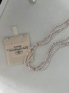 Dreireihige Halskette aus zartrosa Perlen